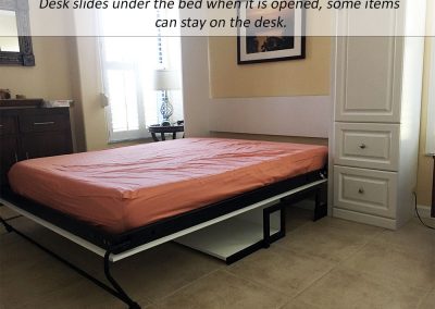 Studio Desk slides under the bed when the Panel Bed is opened for guests