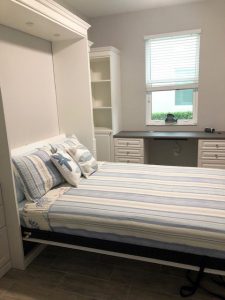 Miller's Murphy Bed & Home Office: bed folded down with flanking bookshelf cabinets