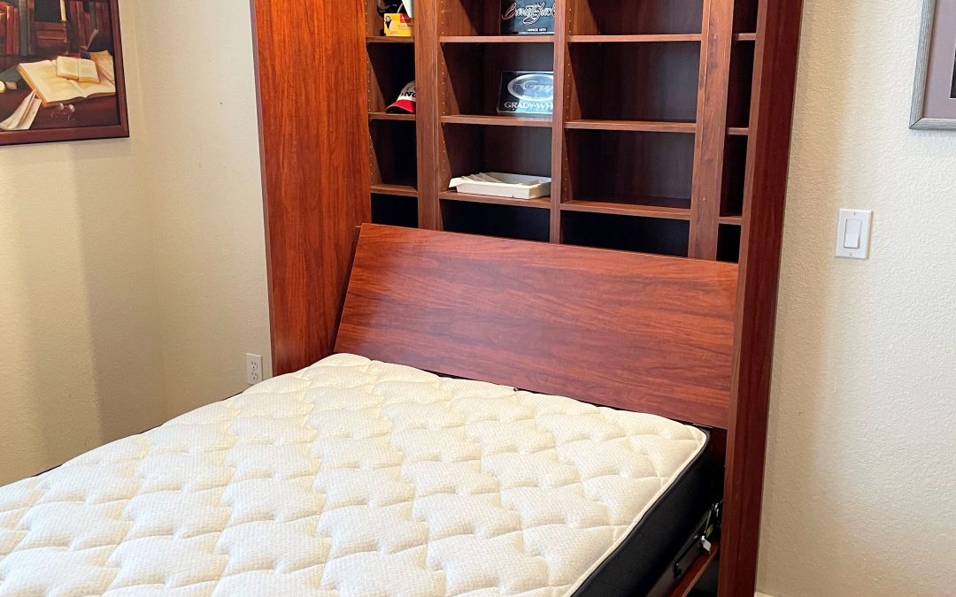 Bed installed in closet with integrated shelving